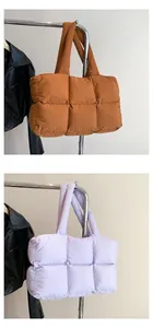 Quilted down-filled puffer tote bag in caramel brown and lilac purple colors