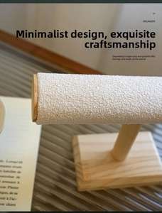 Detail of jewelry display stand featuring natural wood base and white fleece textured T-bar