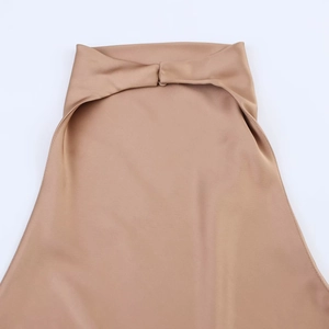 Detail shot of the glossy champagne satin neck strap with premium sewing texture