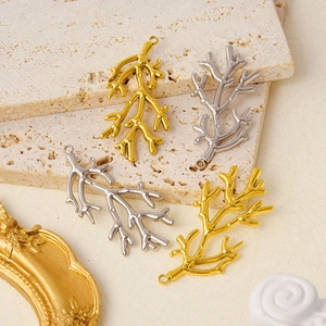 Detailed view of gold and silver 304 stainless steel coral branch pendants for DIY jewelry