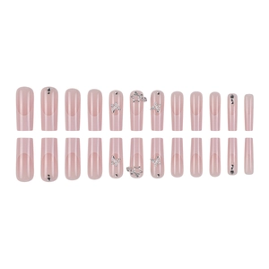French style press-on nails set with silver butterfly and star accents on nude pink base