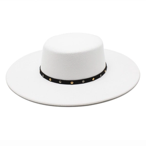 Detail of white wool felt boater hat with black ribbon and metallic stud embellishments