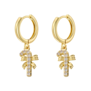 Detail of gold-colored candy cane earrings with sparkling zircons and bow accents