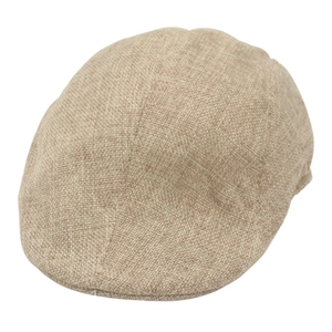 Detail of beige flat cap showing breathable woven texture and neat stitching on fabric
