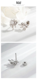 Macro detail of the screw-back stud earrings with fireworks starburst zircon setting