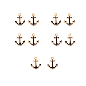 Detail of 10 golden anchor charms with black enamel finish for DIY jewelry making