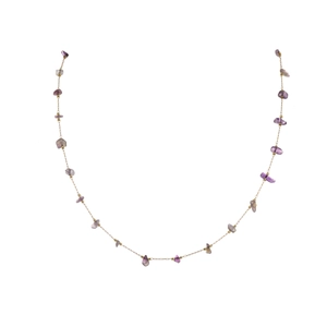 Close-up of gold chain necklace with natural purple amethyst raw gemstone chips