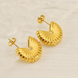 Elegant gold titanium steel shell earrings with vertical stripes and centered zircon stone