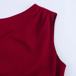 Detailed view of wine red linen dress neckline with professional pleated craftsmanship