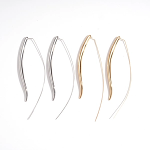 Minimalist metallic teardrop drop earrings in gold and silver finishes on white background
