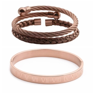 Detail of rose gold stainless steel bracelet set with Roman numeral engravings