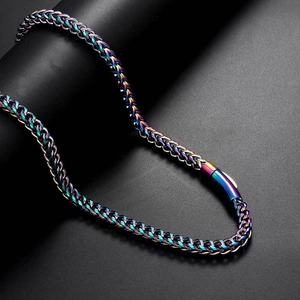Close-up of rainbow PVD stainless steel wheat chain necklace with spring clasp detail