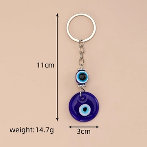 Detail view of evil eye keychain with dimensions 11cm length and 3cm width measurements