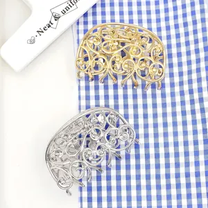 Elegant hollow metal butterfly hair claws in gold and silver finish with vintage patterns