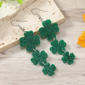 Sparkling green four-leaf clover drop earrings with glitter finish for St. Patrick's Day