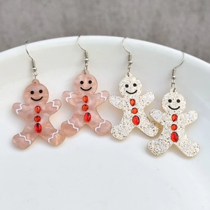 Boucles d'oreilles bonhomme pain d'épice en acrylique avec strass sur plat céramique