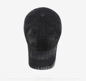 Top view of vintage distressed denim baseball cap with washed texture and ripped detail