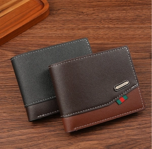 Macro shot of bifold leather wallets featuring contrast stitching and stripe details