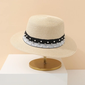 Elegant beige straw sun hat with pearl and rhinestone ribbon for summer beach vacation