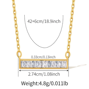 Detailed view of rectangular gold pendant with sparkling white zircons and dimensions