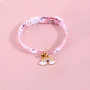 Close-up of pink floral pet collar with rainbow cloud charm and golden bell detail