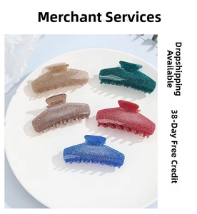 Detail of five translucent hair claws with gold glitter finish in various colors