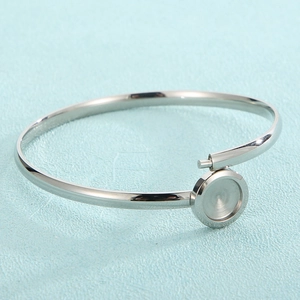 Minimalist silver stainless steel open bangle with round setting for DIY gemstone inlay