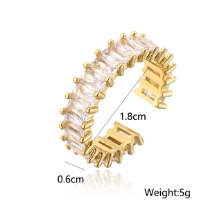 Detailed view of gold plated geometric ring with cubic zirconia and size specifications