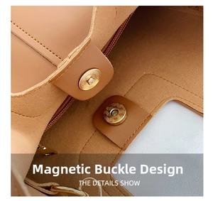 Close-up of magnetic clasp and soft suede lining on brown leather bucket bag