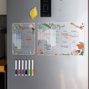 Magnetic acrylic weekly calendar set with six colored markers on a fridge door