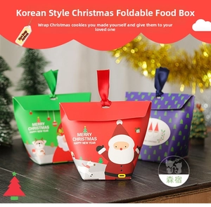 Detailed view of Christmas gift boxes with festive illustrations and satin ribbon handles