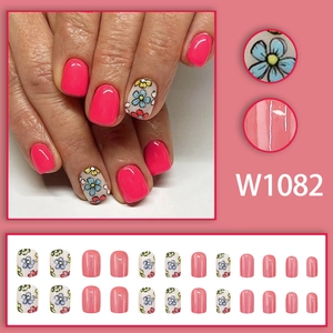 Pink floral press-on nail kit with colorful flower patterns and 24-piece glossy finish