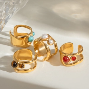Set of four gold stainless steel open rings with turquoise, pearl and agate stones
