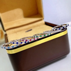 Close-up of S925 silver eternity rings with colorful zircon stones in a gift box