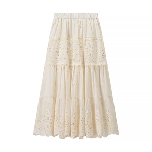 Detailed view of cream lace tiered maxi skirt featuring elastic waist and embroidery