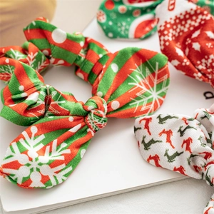 Detailed view of Christmas cloth scrunchies with festive snowflake and reindeer patterns