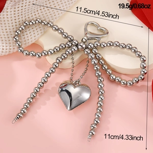 Silver bow keychain with beads and heart pendant showing 11.5cm width and 11cm height