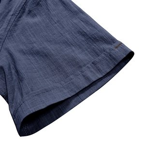 Close-up of sleeve stitching on dark blue linen short-sleeve shirt for men