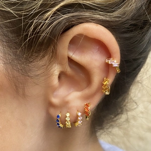 Vintage gold hoop earrings with multi-colored rectangular zircons shown on ear