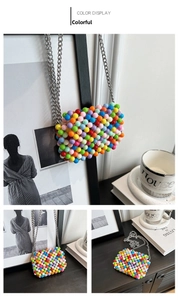 Detailed close-up of a handmade candy-colored beaded mini crossbody bag with silver chain