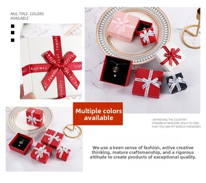 Detailed view of square jewelry gift boxes with ribbons and sponge lining for rings