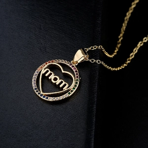 Golden necklace with circular MOM pendant featuring a heart and colorful zircon stones