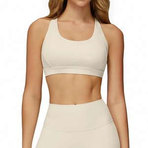 Beige cross-back yoga bra and high-waist leggings set for professional fitness workout