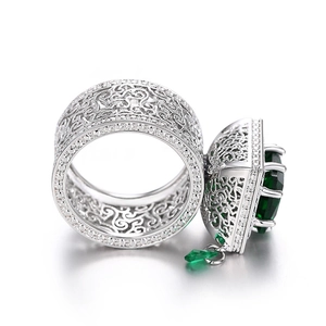 Luxurious silver ring with hollow patterns, green square gemstone and small drop pendant