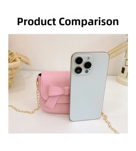 Pink mini girls' crossbody bag with bow and gold chain compared next to a phone