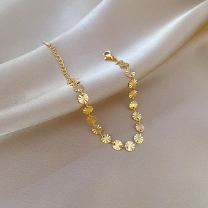 Bracciale minimalista in acciaio al titanio dorato con dischi geometrici tondi a raggi solari