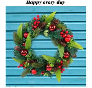 Detailed close-up of a Christmas wreath with red berries, pine cones and shiny ornaments