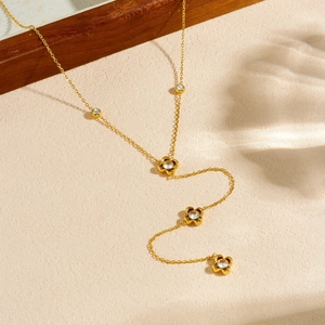 Gold-plated stainless steel Y-shaped necklace with hollow floral charms and zircons
