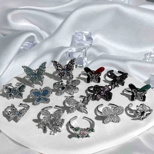 Exquisite butterfly rings set in various colors with rhinestones and enamel details