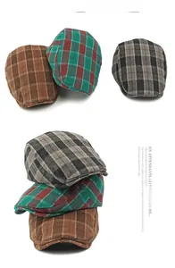 Close-up of retro plaid ivy caps in brown and green patterns with detailed fabric texture